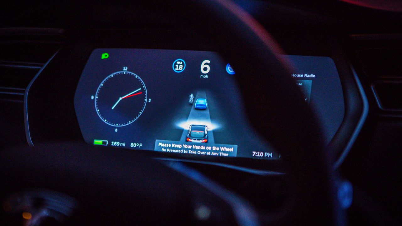 An instrument panel with the Tesla Motors Inc. 8.0 software update illustrates the road ahead using radar technology inside a Model S P90D vehicle in the Brooklyn borough of New York, U.S., on Tuesday, Sept. 20, 2016.