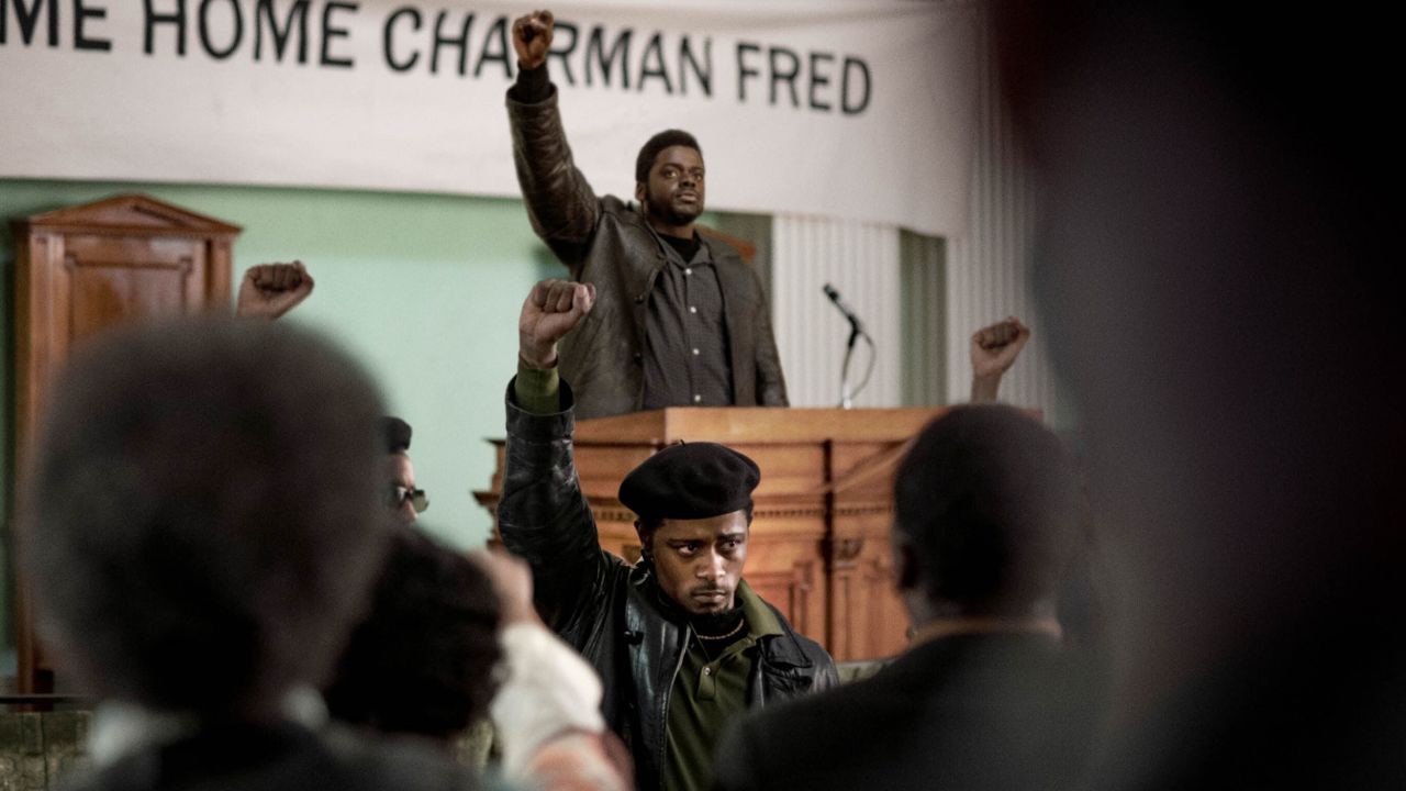FBI informant William O'Neal (LaKeith Stanfield) stands in the foreground, as Fred Hampton Sr. (Daniel Kaluuya) delivers a speech in the Oscar-nominated "Judas and the Black Messiah."