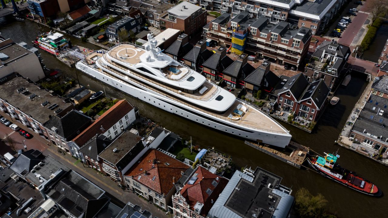 Feadship's new superyacht Project 817 is guilded through the canals of Holland while en route to the North Sea.