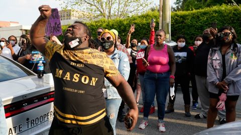 People gather Wednesday outside the A. Parker Midgett Municipal Building in Elizabeth City.