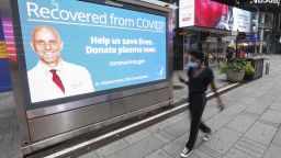 An electronic screen in New York City in August shows an advertisement calling for plasma donation from patients recovered from Covid-19.