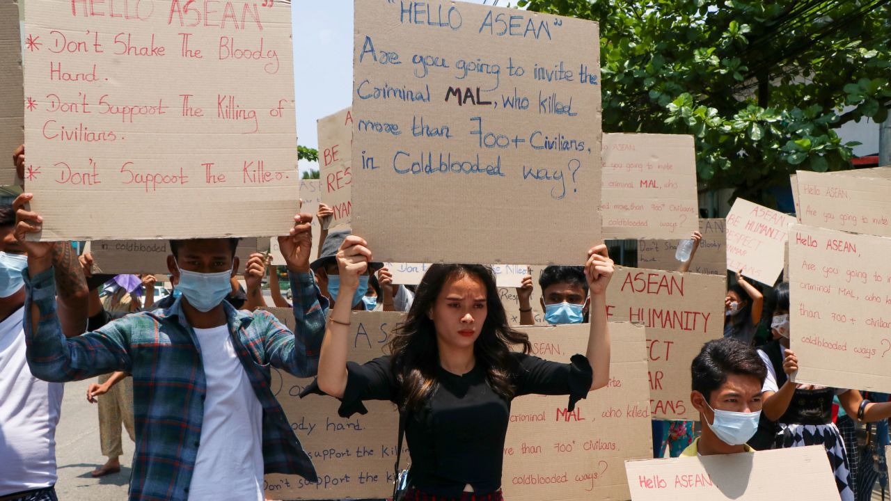 Anti-coup protesters hold slogans calling the attention of an ASEAN regional meeting during a rally on April 20, 2021 in Yangon, Myanmar.