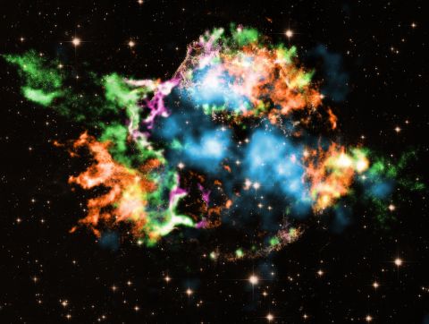 Astronomers used NASA's Chandra X-ray Observatory to study the supernova remnant Cassiopeia A and discovered titanium, shown in light blue, blasting out of it. The colors represent other elements detected, like iron (orange), oxygen (purple), silicon (red) and magnesium (green).
