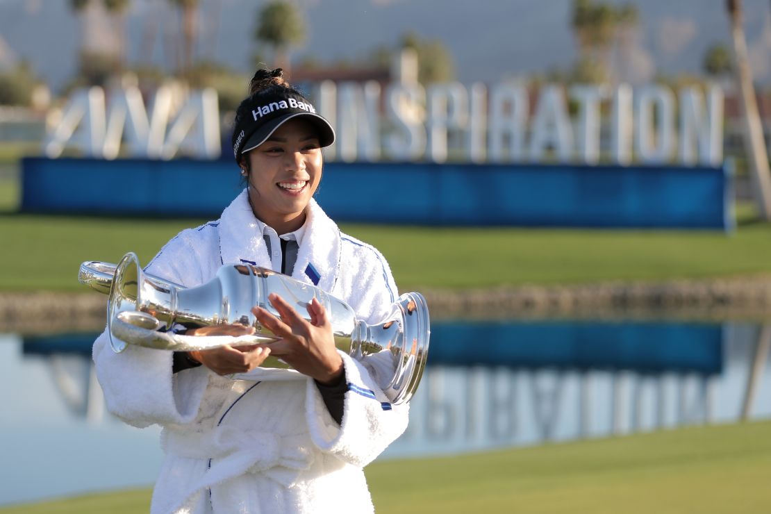 Tavatanakit poses with the trophy after winning the ANA Inspiration.