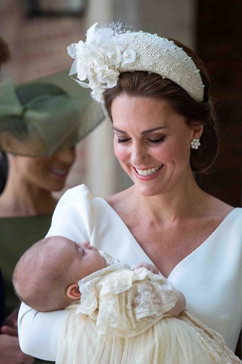 Kate holds Prince Louis on their arrival for his christening service at the Chapel Royal, St James's Palace, London, on July 9, 2018.