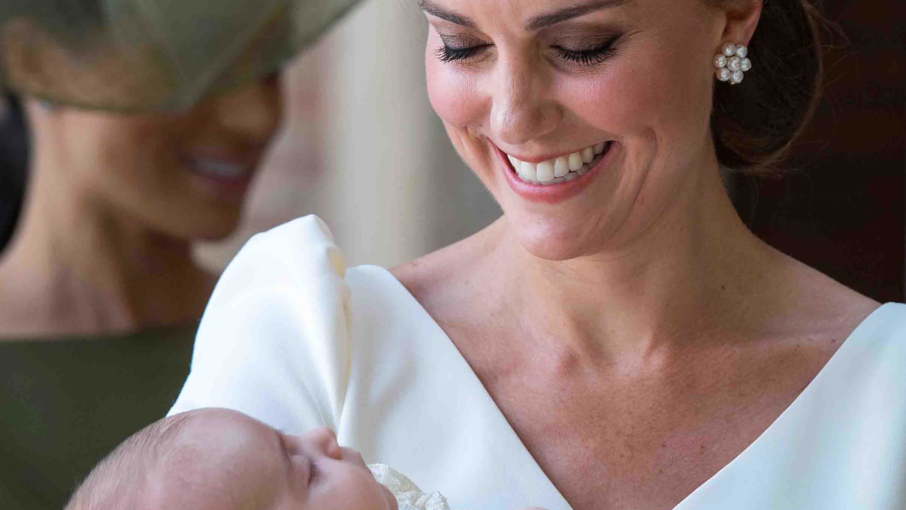 Catherine holds Prince Louis after arriving for his christening service in London in July 2018.