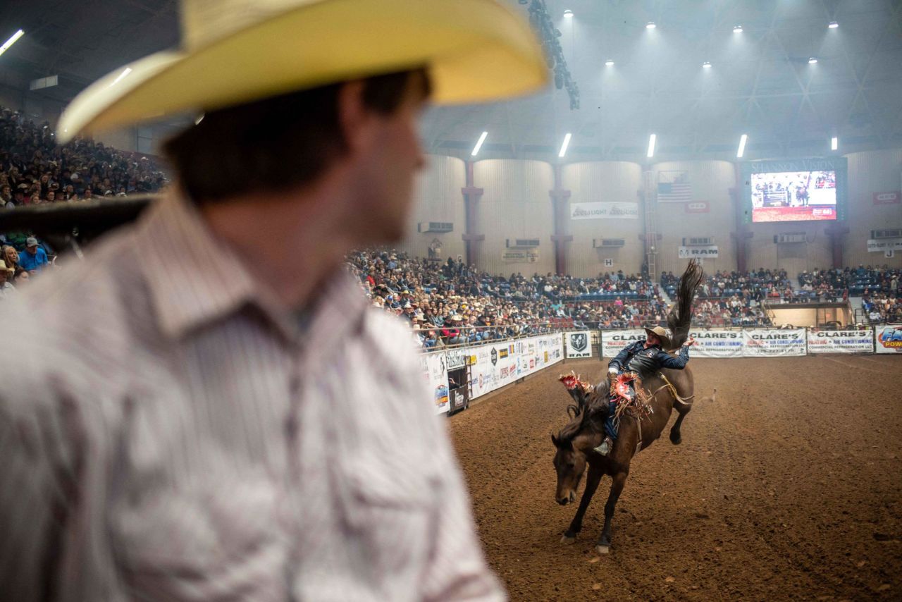 Ty Bertrand watches a rider on a horse at the San Angelo Stock Show and Rodeo on April 16 in San Angelo, Texas. 