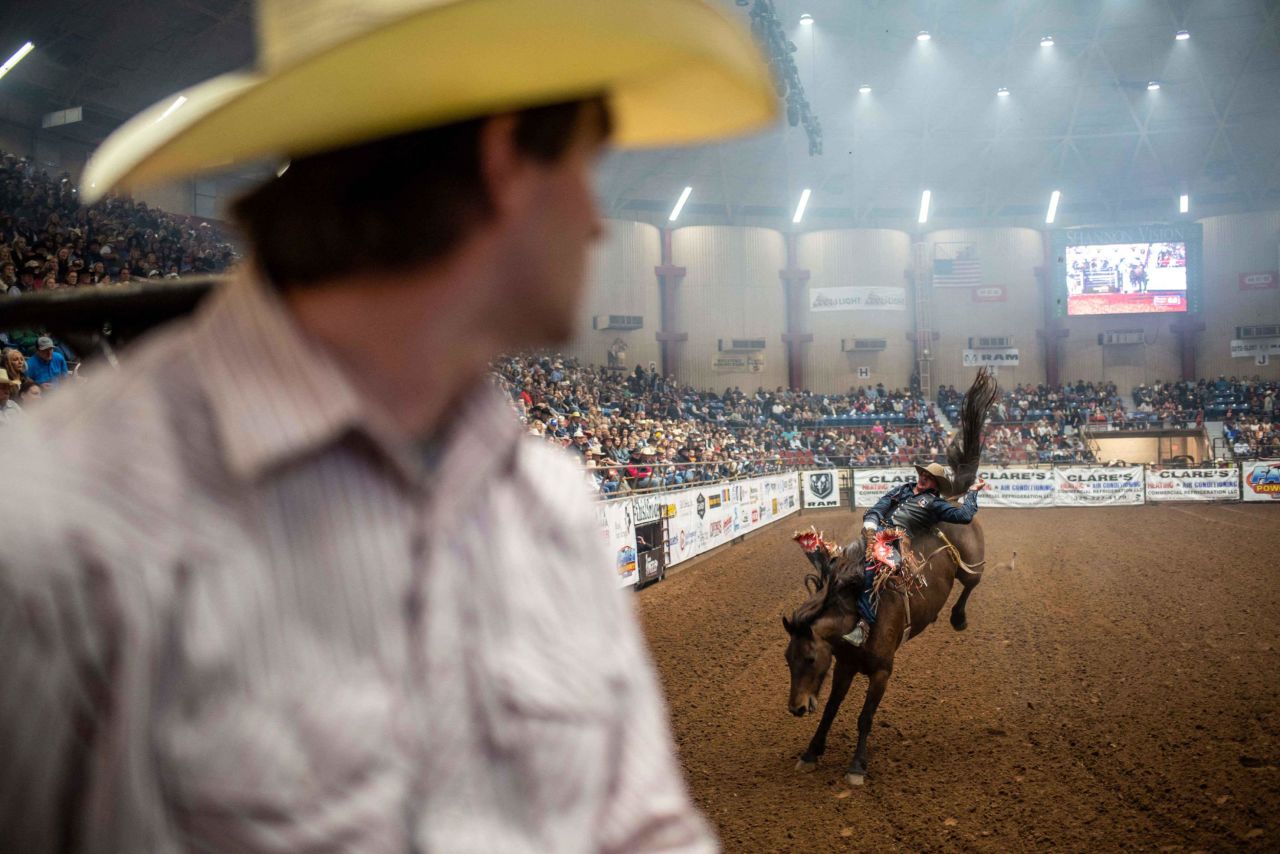 Ty Bertrand watches a rider on a horse at the San Angelo Stock Show and Rodeo on April 16 in San Angelo, Texas.