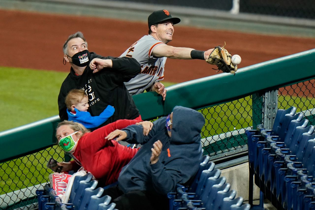 San Francisco Giants right fielder Mike Yastrzemski reaches for a foul ball during a game against the Philadelphia Phillies on April 20, in Philadelphia.