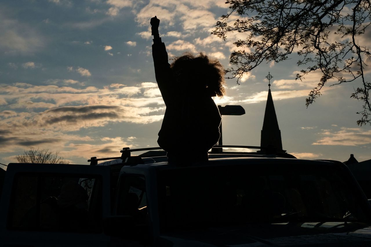 A woman raises her fist during a vigil in Columbus, Ohio, on Wednesday, April 21, to remember <a href="https://www.cnn.com/2021/04/21/us/ohio-columbus-police-shooting-15-year-old/index.html" target="_blank">Ma'Khia Bryant</a>, a 16-year-old who was fatally shot by a police officer on Tuesday.