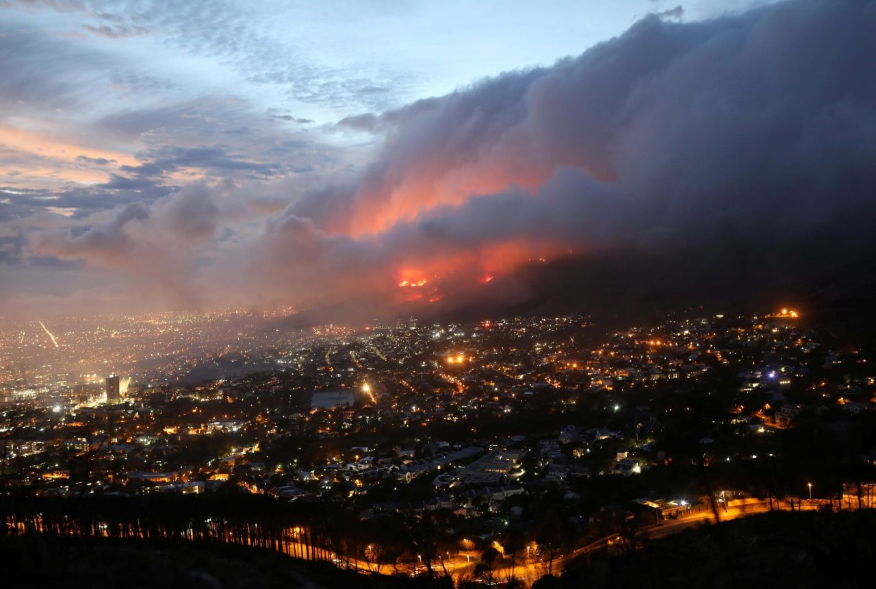 Flames burn close to the city after <a href="https://www.cnn.com/2021/04/18/africa/table-mountain-south-africa-fire-intl-afr/index.html" target="_blank">a bushfire broke out</a> on Table Mountain in Cape Town, South Africa, on Monday, April 19. 