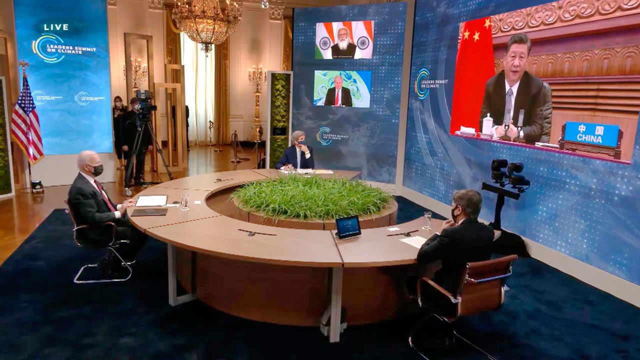 Chinese President Xi Jinping, right (on screen), attending the virtual climate summit with other world leaders on April 22.