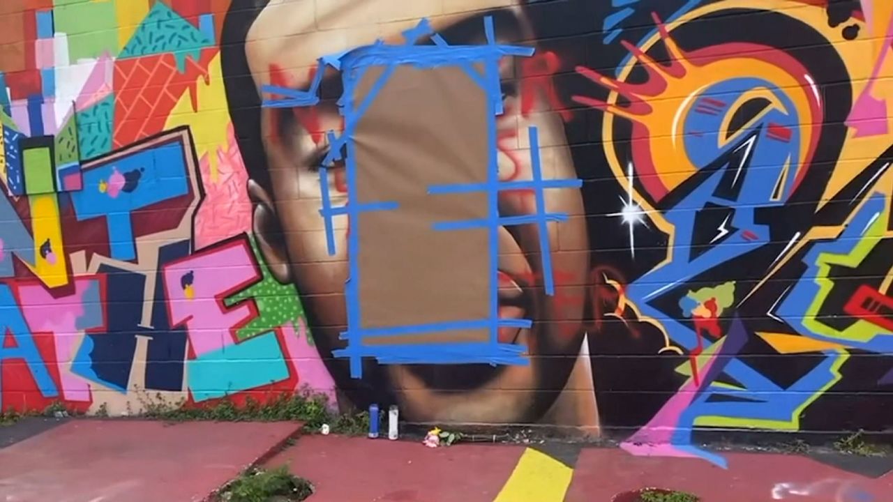 The mural was earlier vandalized with a racial epithet