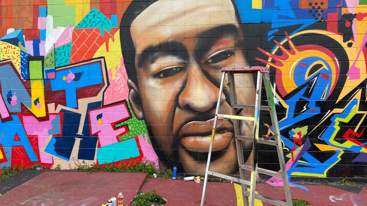 A mural of George Floyd located in Houston was restored after being vandalized 