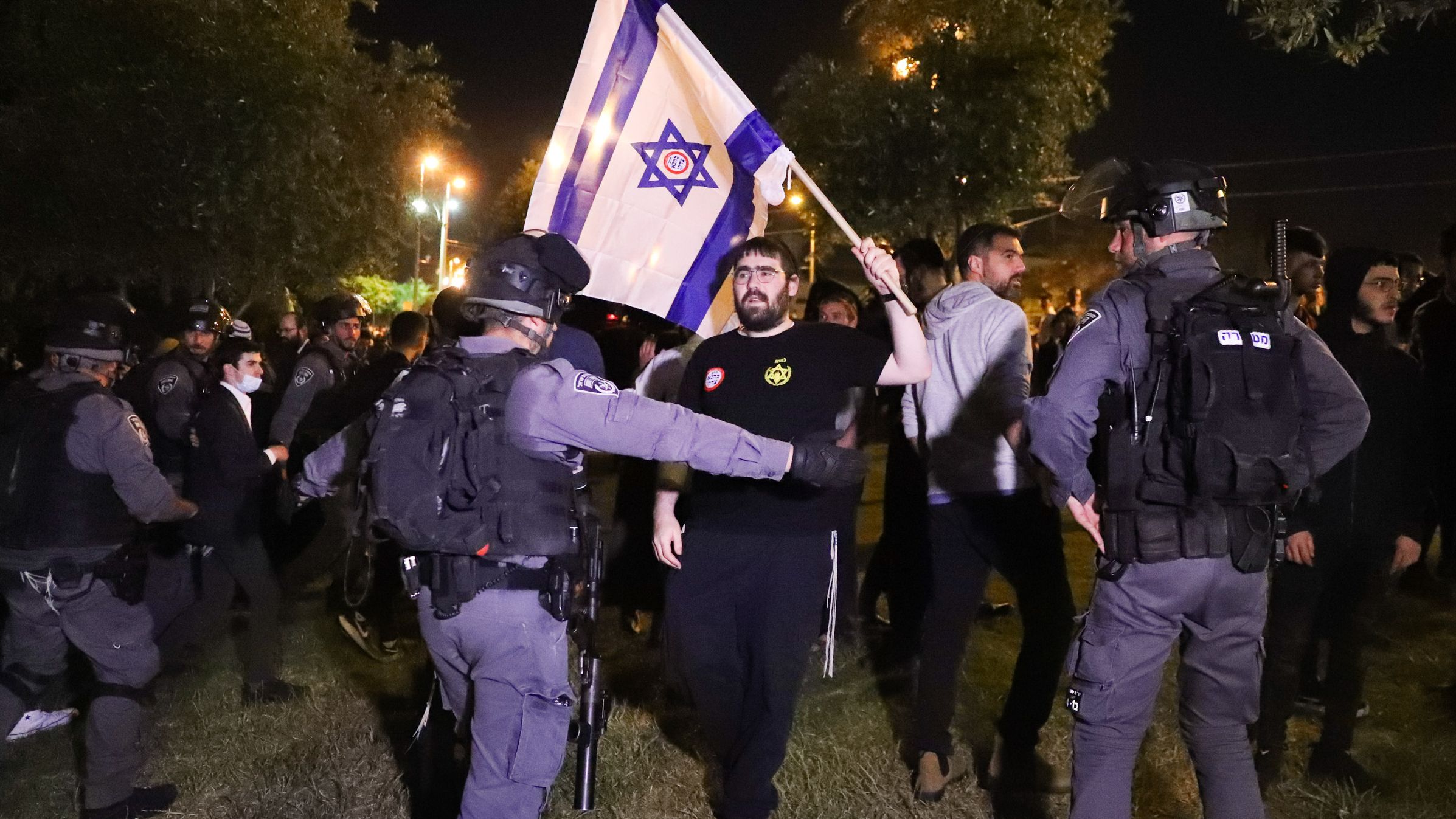 Israeli border police block members of Lehava, a Jewish extremist group, near Damascus Gate amid heightened tensions in the city.