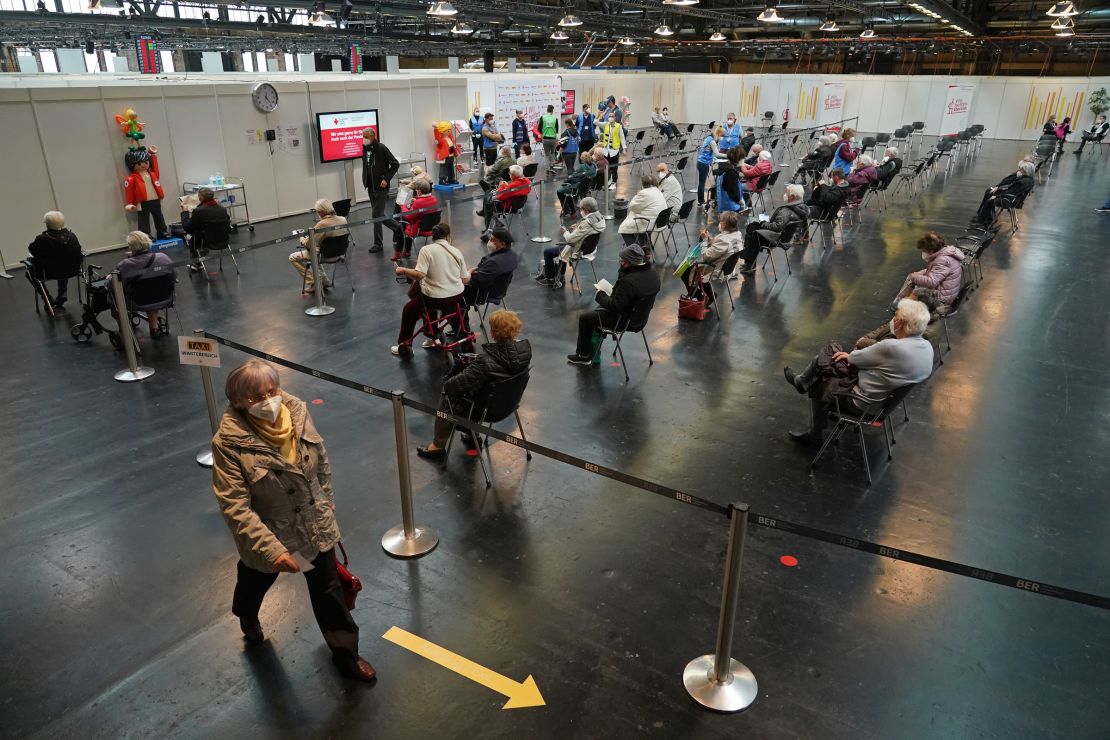 Patients sit in a monitoring area after they were inoculated with the Pfizer/BioNTech vaccine against Covid-19 at a mass vaccination center on April 15, 2021 in Berlin, Germany.
