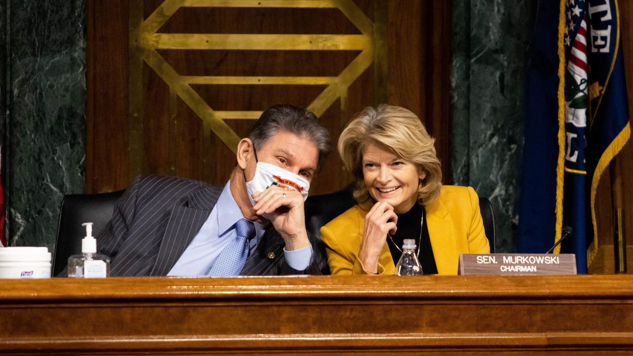 Sen. Lisa Murkowski, an Alaska Republican, confers with Sen. Joe Manchin, a Democrat from West Virginia, during a hearing in January on Capitol Hill in Washington, DC. 