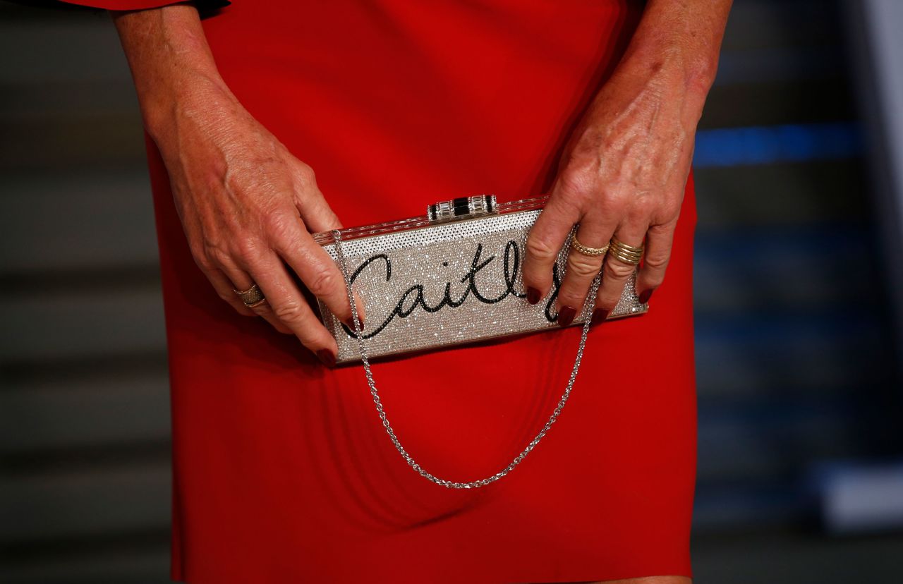Jenner holds her clutch purse on the red carpet of the 2018 Vanity Fair Oscar party.
