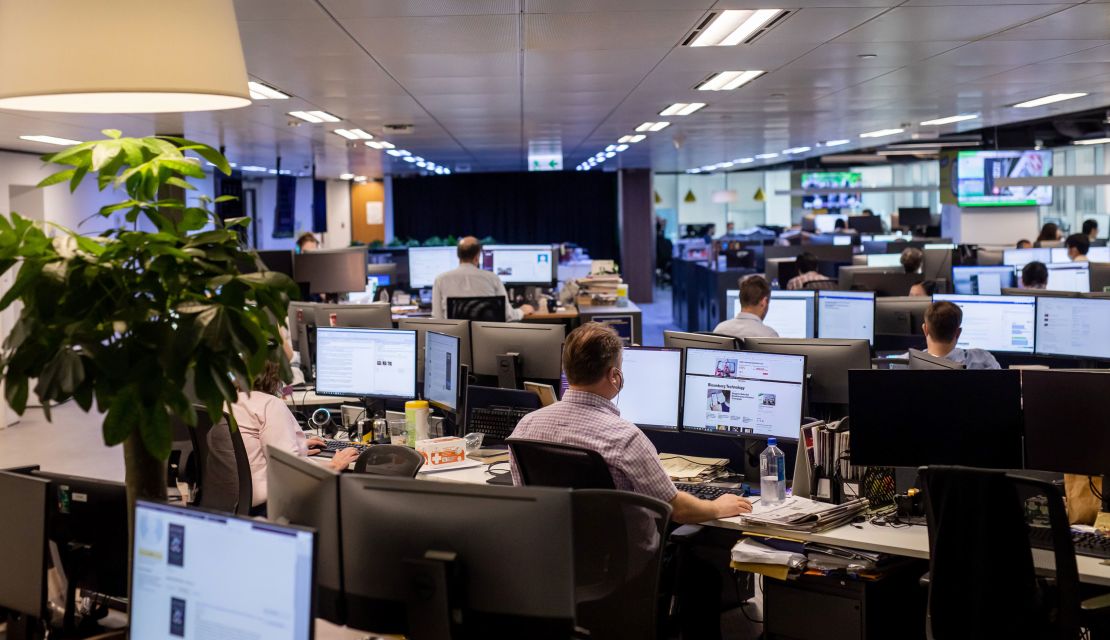 Employees work in the newsroom of the South China Morning Post (SCMP) in Hong Kong, on June 5, 2020. 