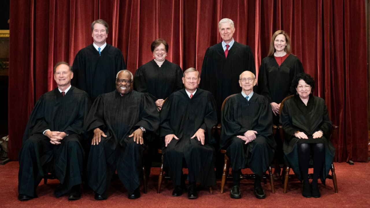 Members of the Supreme Court pose for a group photo at the Supreme Court in Washington, Friday, April 23, 2021. 
