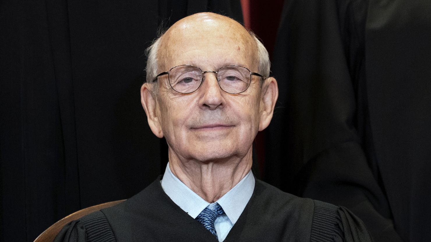 Associate Justice Stephen Breyer sits during a group photo at the Supreme Court in Washington, Friday, April 23, 2021.