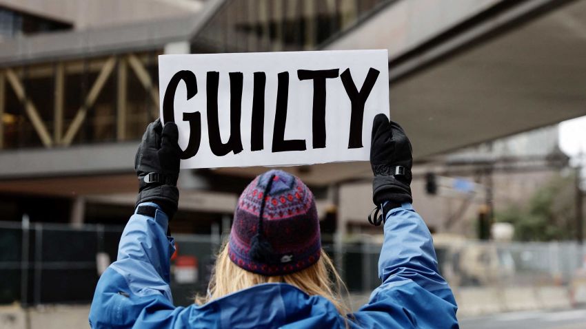 A protester holds a "guilty" sign outside the Courthouse In Minneapolis, Minnesota on April 19, 2021. - A jury is to hear closing arguments on April 19, 2021 in the trial of the white ex-police officer accused of murdering African-American George Floyd, a case that laid bare racial wounds in the United States and has come to be seen as a pivotal test of police accountability. Derek Chauvin, a 19-year veteran of the Minneapolis Police Department, faces a maximum of 40 years in prison if convicted of the most serious charge -- second-degree murder. (Photo by Kerem YUCEL / AFP) (Photo by KEREM YUCEL/AFP via Getty Images)