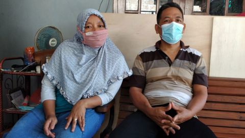 Sumiyati, left, and Sunaryo await news of their son, Gunadi Fajar Rahmanto, who is one of the crew members on the missing submarine, at their home in Yogyakarta, Indonesia, on April 24.