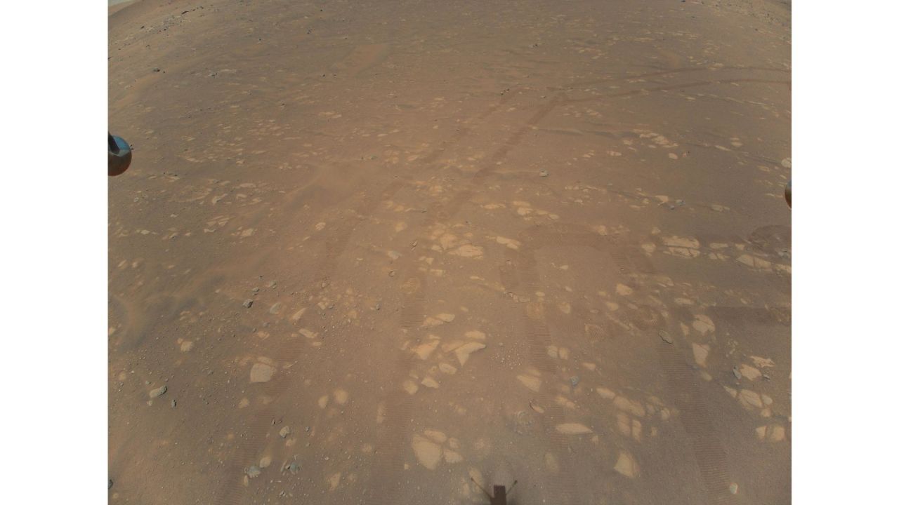 Details of the helicopter's airfield can be seen from this April 22 image. The helicopter's shadow is visible at the bottom, its landing feet on either side, and rover tracks are also apparent.