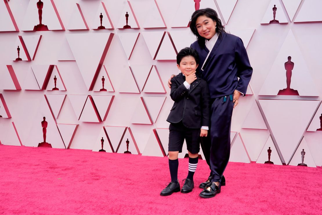 Alan S. Kim, left, alongside Christina Oh on the red carpet.