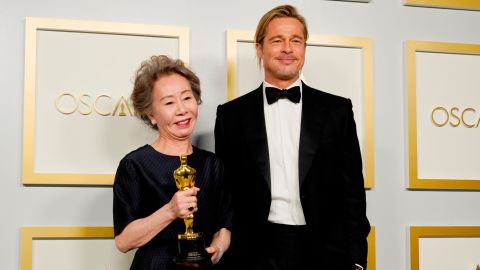 Yuh-jung Youn and Brad Pitt in the press room at the Academy Awards. (Photo by Chris Pizzello-Pool/Getty Images)
