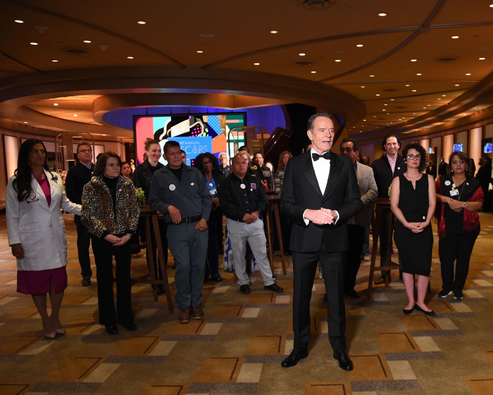 Actor Bryan Cranston recognizes some of the vaccinated front-line workers who were at the Dolby Theatre on Sunday night. Cranston was presenting the Jean Hersholt Humanitarian Award to the Motion Picture and Television Fund for the group's help and assistance to productions during the coronavirus pandemic.