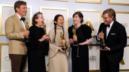 LOS ANGELES, CALIFORNIA - APRIL 25: (L-R) Peter Spears, Frances McDormand, Chloe Zhao, Mollye Asher, and Dan Janvey, winners of Best Picture for "Nomadland," pose in the press room at the Oscars on Sunday, April 25, 2021, at Union Station in Los Angeles. (Photo by Chris Pizzello-Pool/Getty Images)