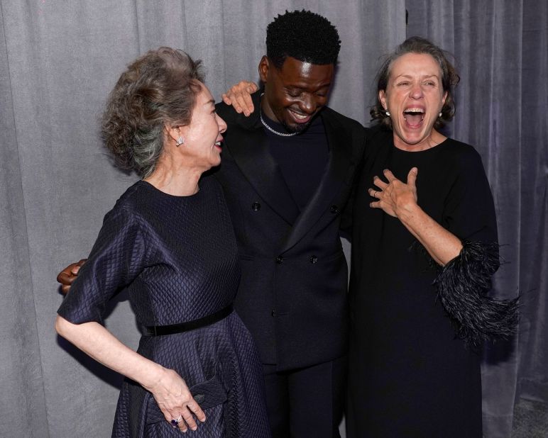 A trio of Oscar winners -- from left, Yuh-jung Youn, Daniel Kaluuya and Frances McDormand -- pose together in the press room. Youn won best supporting actress for her role in "Minari." Kaluuya won best supporting actor for his role in "Judas and the Black Messiah." And McDormand won best actress for "Nomadland."