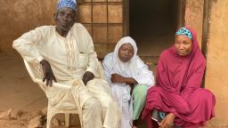 Iliyasu Magaji, father, 65, Habiba Iliyasu, 15 and her mother Rukkaya Iliyasu, 58 pose for photographs after telling CNN about their ordeal at the hands of kidnappers in northern Nigeria.