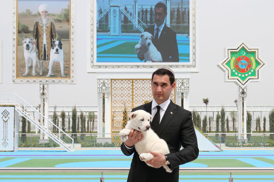 Serdar Berdymukhamedov, the President's son and deputy, holds a puppy during the event.