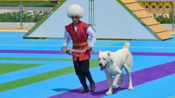 A man dressed in a national costume runs with his border guard shepherd dog Alabay during Dog Day celebration in Ashgabat, Turkmenistan, Sunday, April 25, 2021. The Central Asian nation of Turkmenistan has celebrated its new state holiday honoring the native Alabay dog breed. President Gurbanguly Berdymukhamedov established the holiday to be observed on the same day that Turkmenistan lauds its Akhla-Teke horse, a breed known for its speed and endurance.