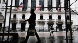 People walk by the New York Stock Exchange on April 15, 2021 in New York City. After major companies reported strong earnings and new economic data points to a rebound in consumer spending, U.S. stocks climbed to record levels on Thursday.