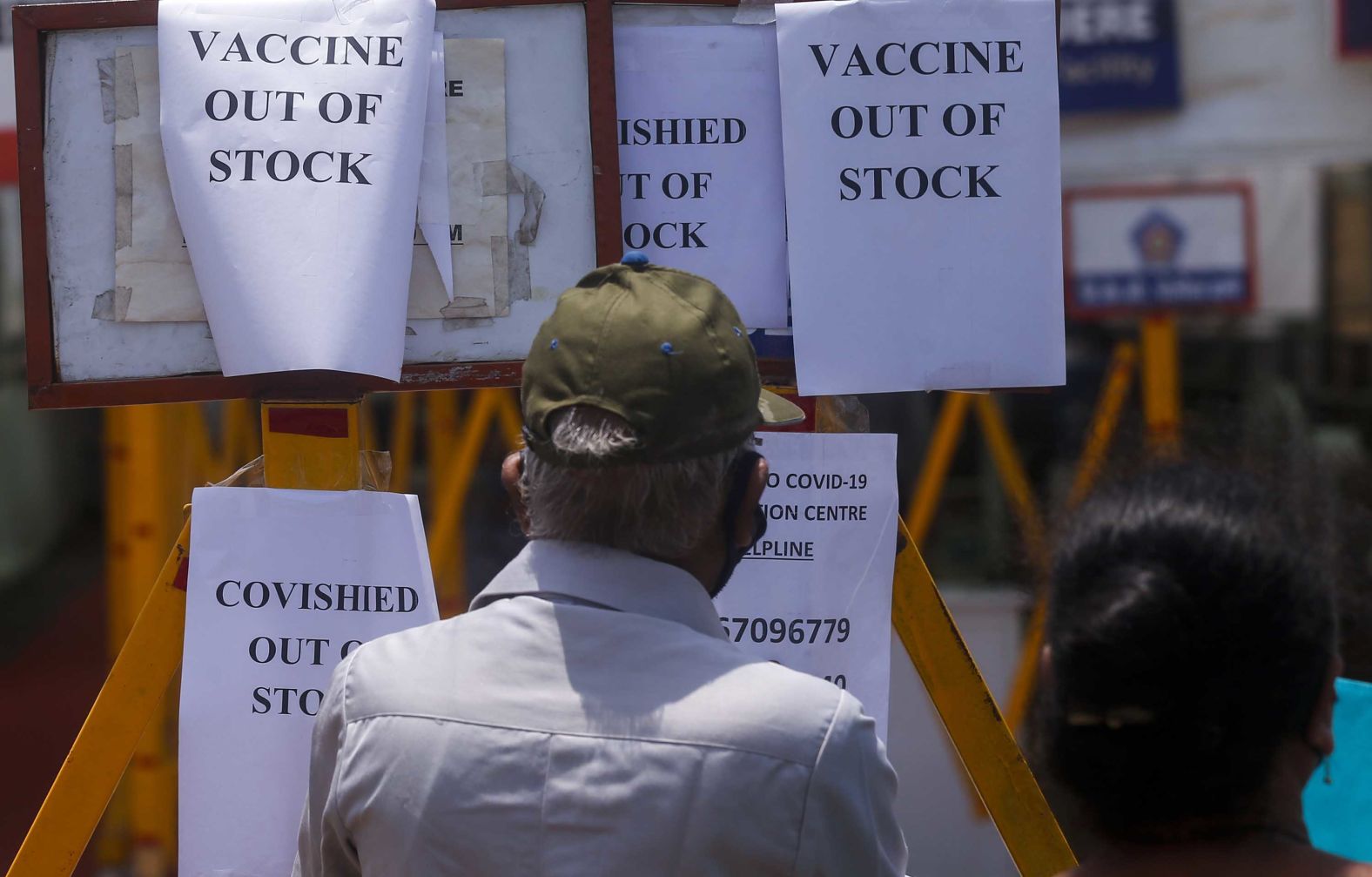 Signs inform people that a vaccination center in Mumbai was out of vaccines on April 20.