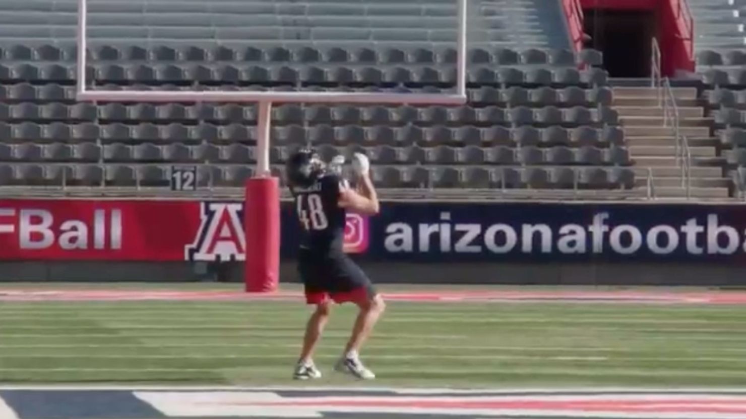 Arizona football alum Gronkowski sets a world record by catching a pass dropped from a helicopter 600 feet in the air. 