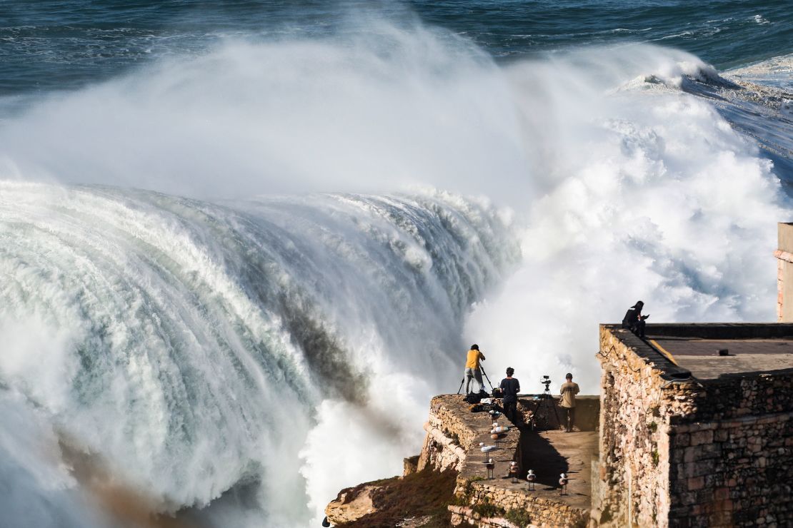 Photographers capture a giant swell at Nazaré last October. 