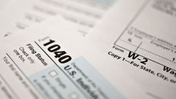 A U.S. Department of the Treasury Internal Revenue Service (IRS) 1040 Individual Income Tax form for the 2019 tax year is arranged for a photograph with a W-2 wage statement in Tiskilwa, Illinois, U.S., on Friday, March 20, 2020. 