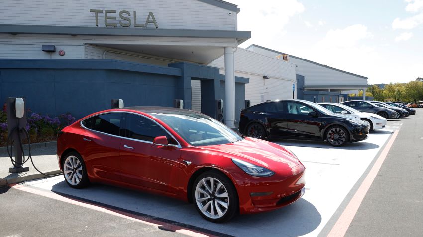 Tesla cars charge at a Tesla Supercharger station on April 26, 2021 in Corte Madera, California.