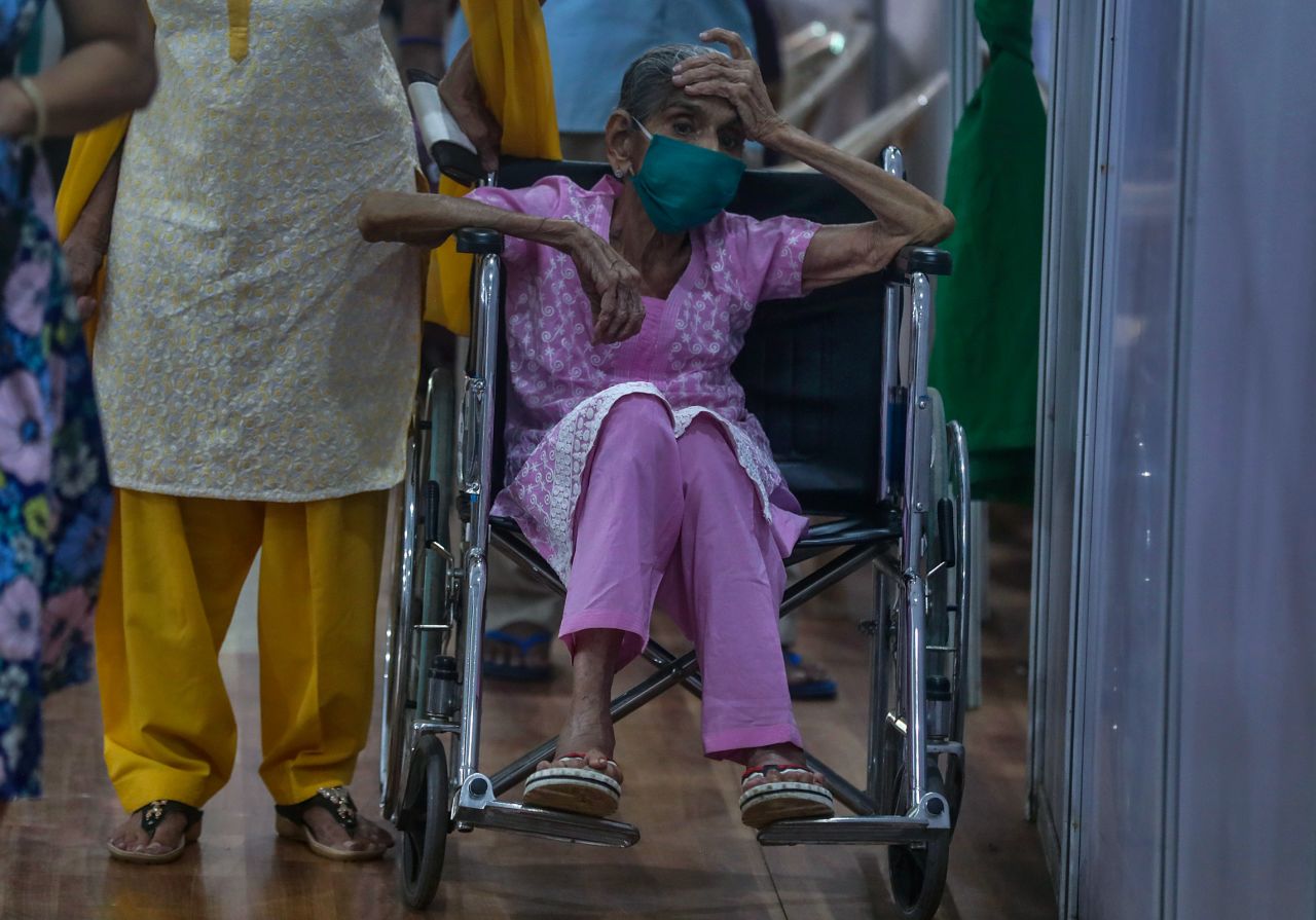 A woman waits to receive a Covid-19 vaccine in Mumbai on April 18.