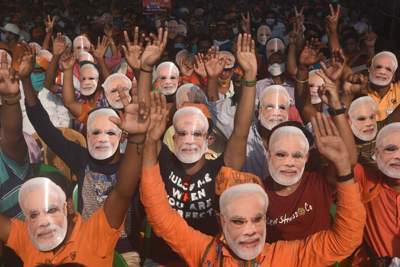 Supporters of the Bharatiya Janata Party wear masks of Prime Minister Narendra Modi during an election rally in Sonarpur on April 3.