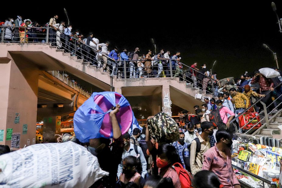 Migrant workers crowd the Kaushambi bus station on April 19. They were trying to return home after a lockdown order was announced in the capital.