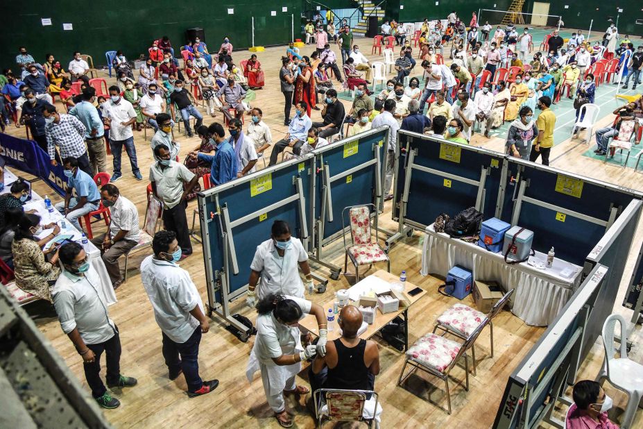 People line up for vaccines at an indoor stadium in Guwahati on April 22.