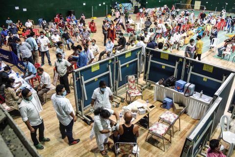 People line up for vaccines at an indoor stadium in Guwahati on April 22.