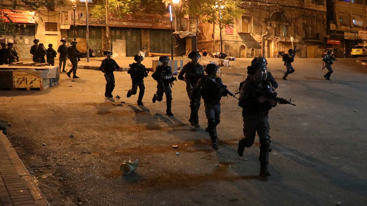 Israeli forces patrol a street during clashes with Palestinian youth in Hebron on April 25.