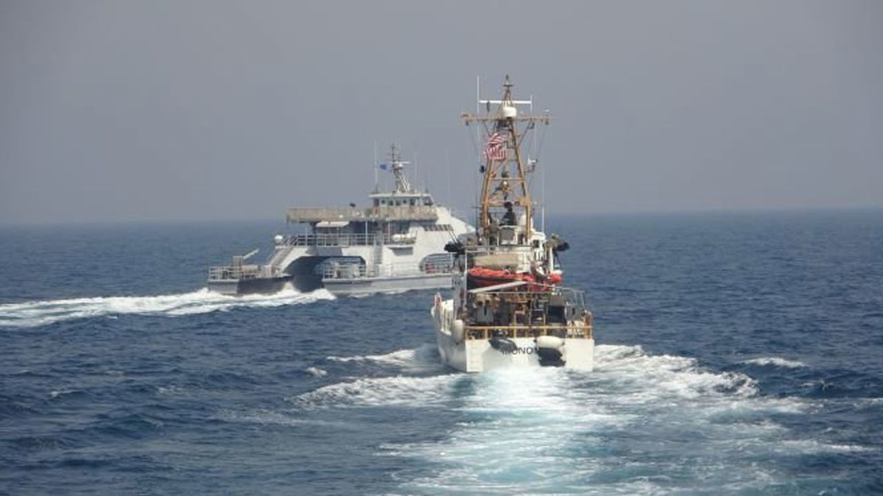 Iran's Islamic Revolutionary Guard Corps Navy (IRGCN) Harth 55, left, conducted an unsafe and unprofessional action by crossing the bow of the Coast Guard patrol boat USCGC Monomoy, right, as the US vessel was conducting a routine maritime security patrol in international waters of the southern Arabian Gulf on April 2, 2021.