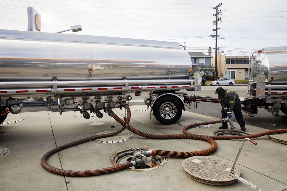 A worker disconnects hoses after delivering gasoline to a station in Redondo Beach, California. A shortage of tanker truck drivers could cause some stations to run out of gas this summer, according to industry experts.